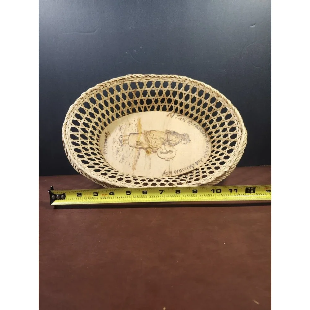 Chilean wicker basket featuring a wood-burned scene of a Mapuche woman from...
